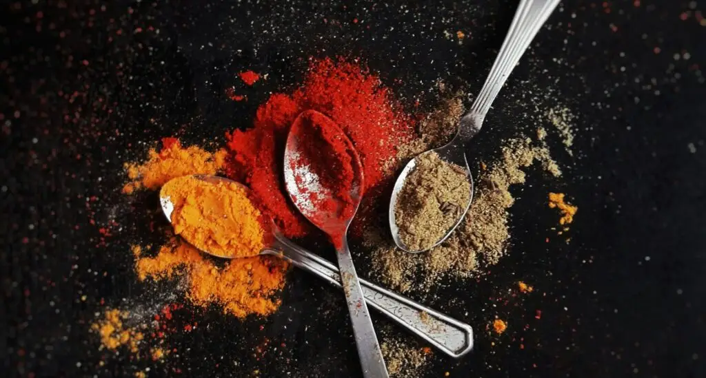 spoonful of turmeric, red chilli and coriander powder